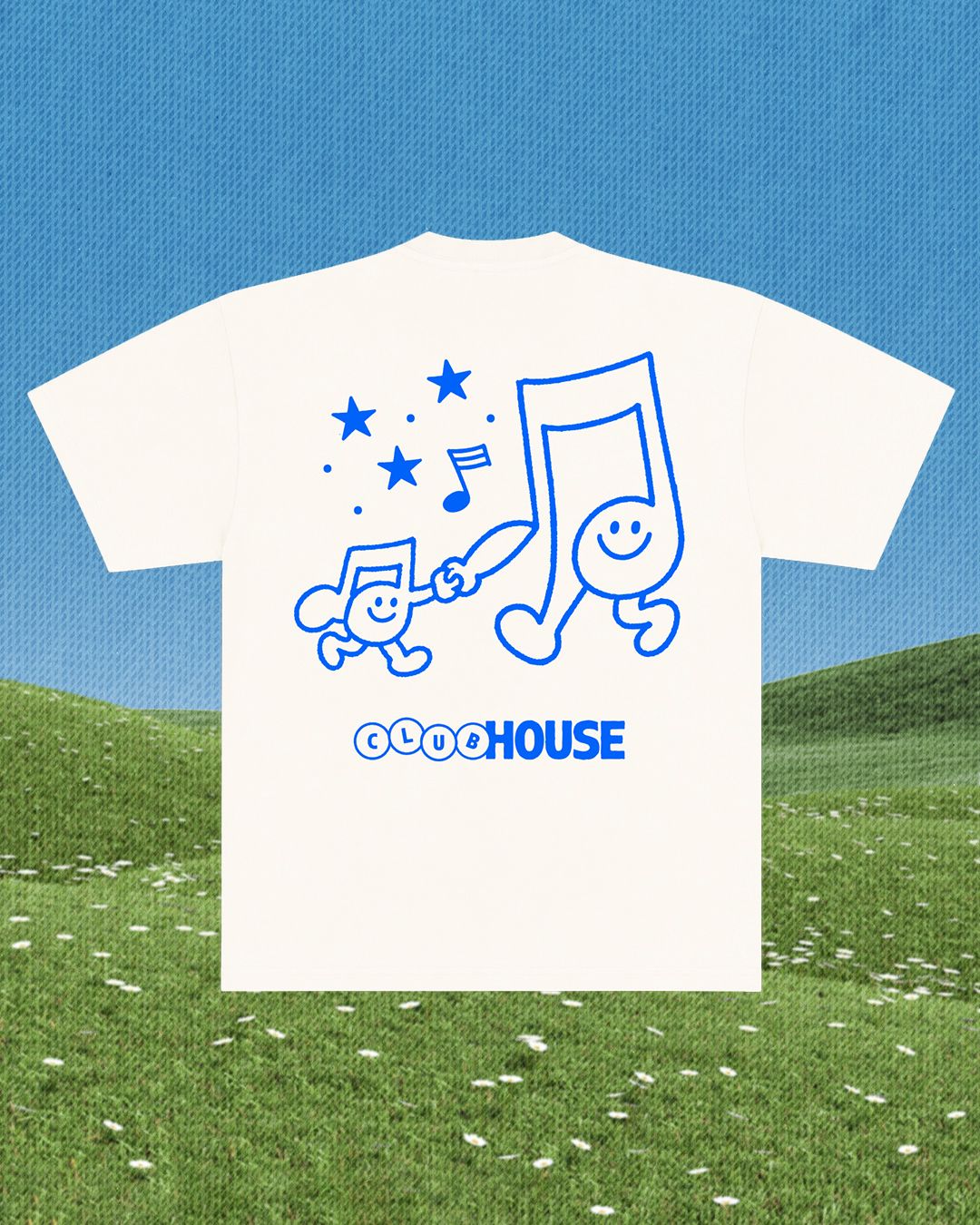 White t-shirt with blue graphics and 'CLUBHOUSE' text on a grassy field with blue sky background